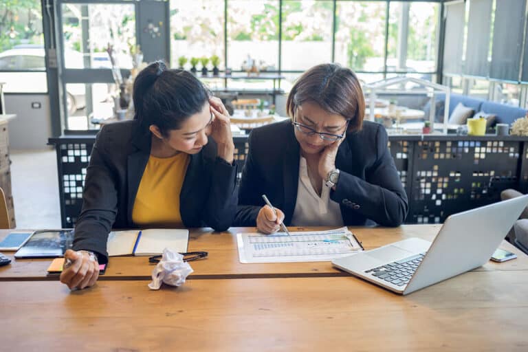 two women working together